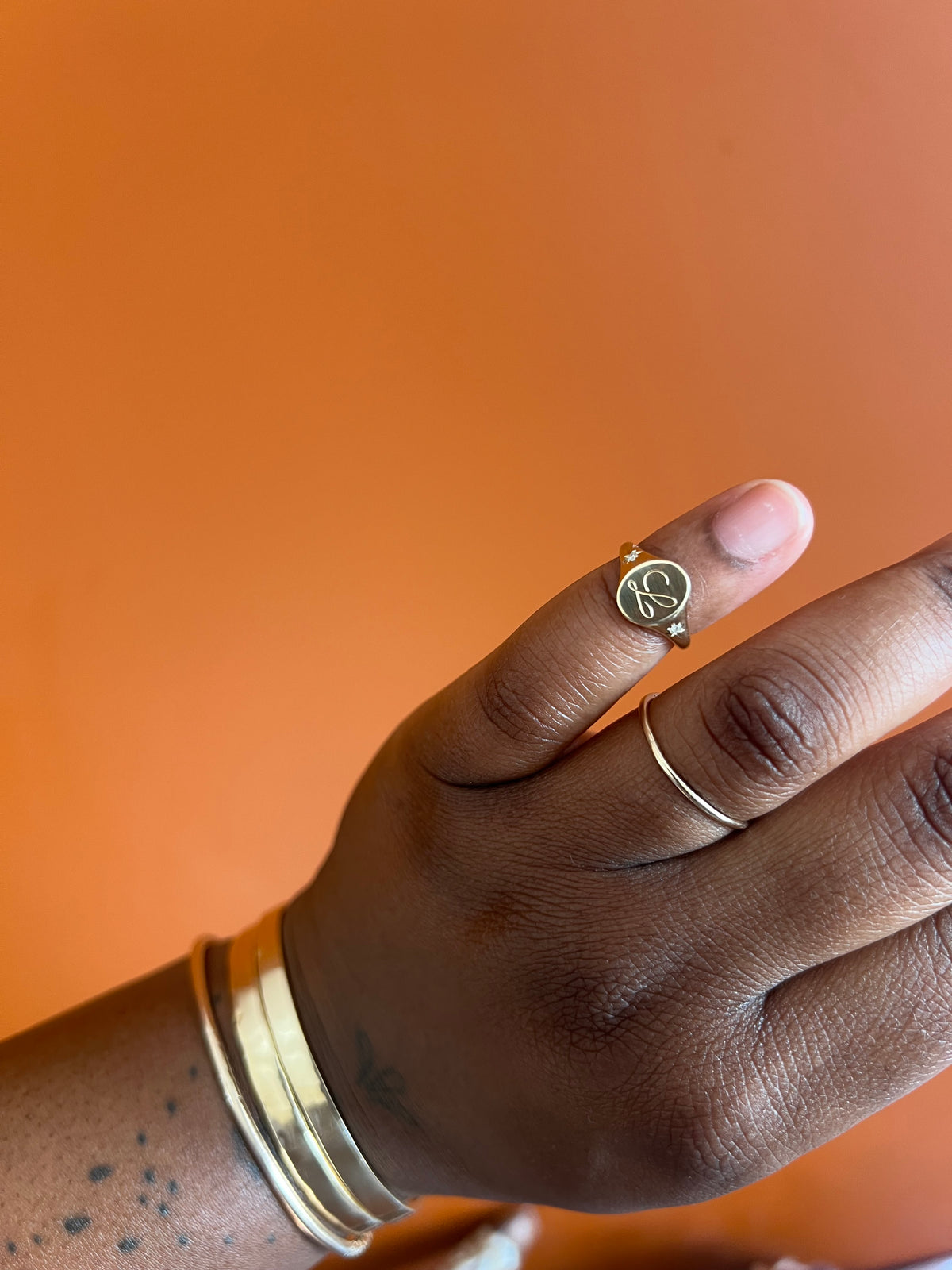 Custom ‘L’ gold signet ring