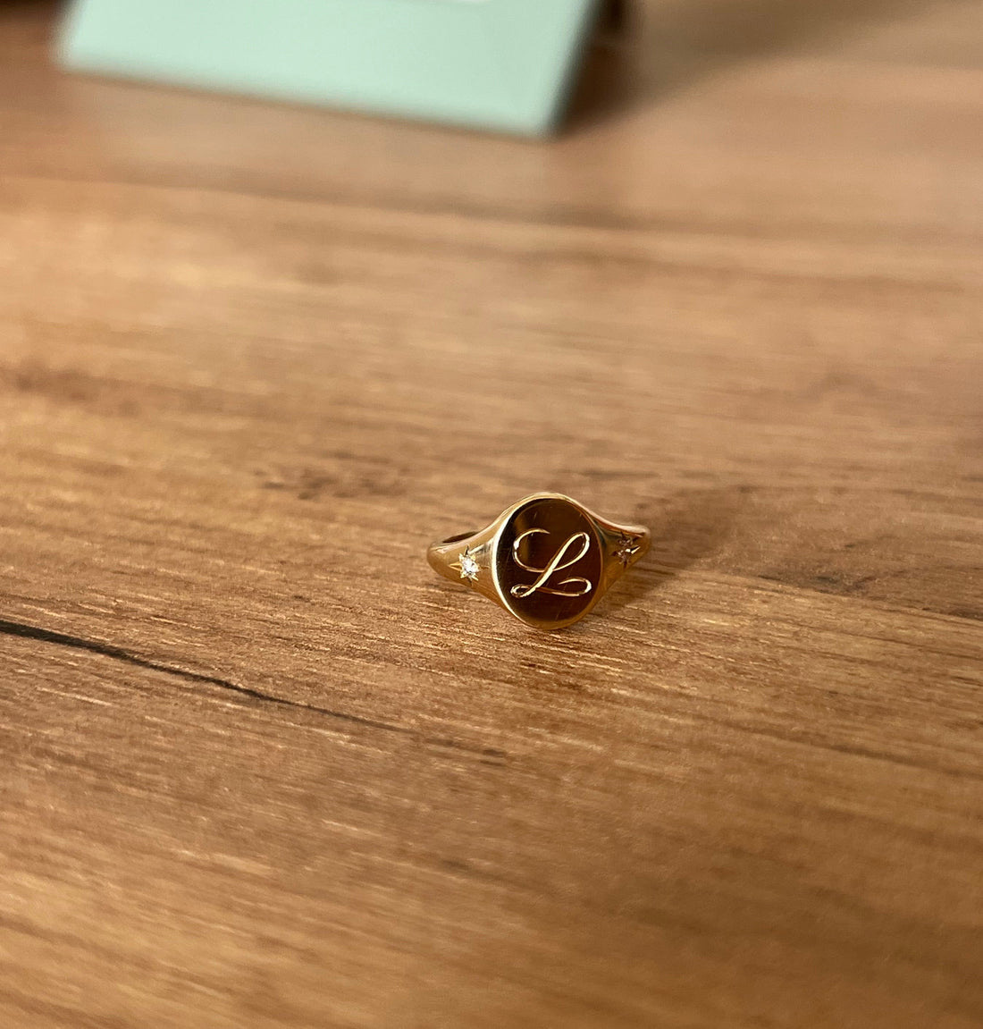 Custom ‘L’ gold signet ring