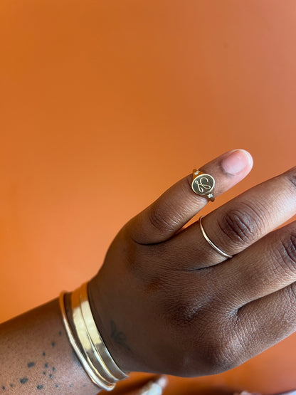 Custom ‘L’ gold signet ring